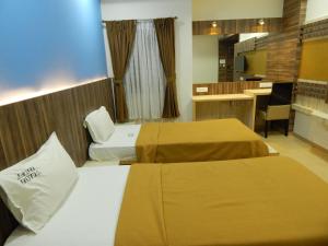 Postel nebo postele na pokoji v ubytování Hotel Aadhi + 37 fotografií