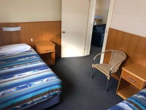 Postel nebo postele na pokoji v ubytování Sheffield Motor Inn