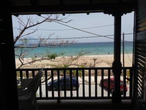 a view of the beach from a house balcony at House Kosmas on the beach in Sarti