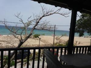 a view of the beach from a porch at House Kosmas on the beach in Sarti