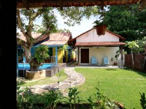 a view of the backyard of a house with a swimming pool at Coco Country Homes in Melaka