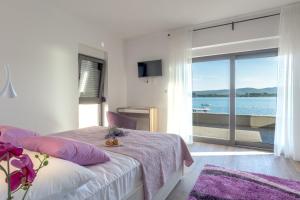 Ένα ή περισσότερα κρεβάτια σε δωμάτιο στο Villa Lu-Ma +39 φωτογραφίες
