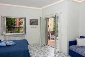 A bed or beds in a room at Ambra Sorrento Suites Short Rent