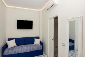 A television and/or entertainment centre at Ambra Sorrento Suites Short Rent