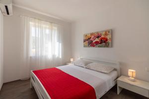 Postel nebo postele na pokoji v ubytování Green Paradise Apartments