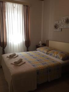 Postel nebo postele na pokoji v ubytování Apartmani Vela Luka