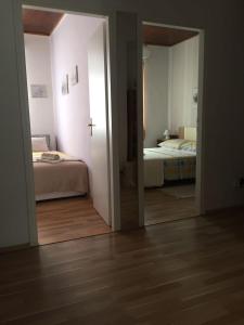Postel nebo postele na pokoji v ubytování Apartmani Vela Luka