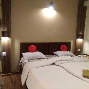 Postel nebo postele na pokoji v ubytování Kumari Guest House