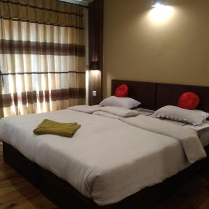 Postel nebo postele na pokoji v ubytování Kumari Guest House