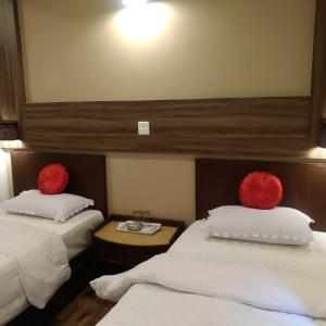Postel nebo postele na pokoji v ubytování Kumari Guest House