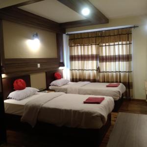Postel nebo postele na pokoji v ubytování Kumari Guest House
