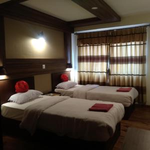 Postel nebo postele na pokoji v ubytování Kumari Guest House