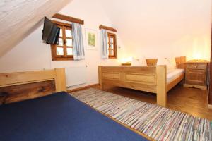 Postel nebo postele na pokoji v ubytování Weingut-Gästezimmer Pongratz