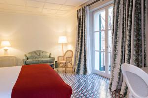 Postel nebo postele na pokoji v ubytování Hotel Cappuccino - Palma