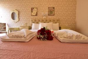a bedroom with a large bed with flowers on it at Petrakis Sea View in Palaiochora