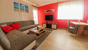 a living room with a couch and a table at Apartment Ana in Rovinj