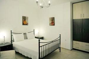 Posteľ alebo postele v izbe v ubytovaní Aerolithos