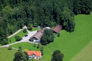 an overhead view of a house in a field at Landhotel Die Waldschänke in Kochel