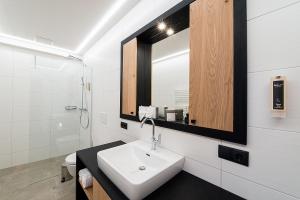 Phòng tắm tại Arthur's Hotel und Apartments am Achensee