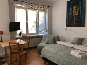 Posteľ alebo postele v izbe v ubytovaní Studio Iwicka