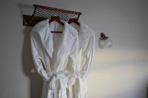 a white dress is hanging on a rack at Albion House at Ramsgate in Ramsgate