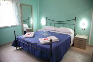 Postel nebo postele na pokoji v ubytování B&b VerdeMare Camerota