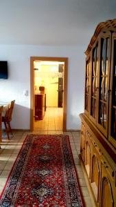 a living room with a hutch and a rug at live in the mkk in Hasselroth