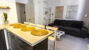 Posezení v ubytování Apartamentos Málaga Picasso