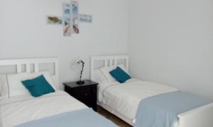 A bed or beds in a room at Appartamento tra mare e storia
