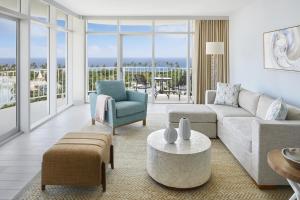 a living room with a couch and a table at The Coral at Atlantis in Nassau