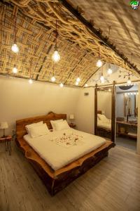 a bedroom with a large wooden bed with a mirror at İksirci Baba Hotel in Oludeniz +114 photos