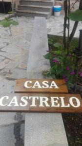 a sign that says casa castoria on a sidewalk at Casa Castrelo in Retorta