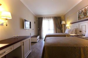 Postel nebo postele na pokoji v ubytování Dalyan Resort & Spa