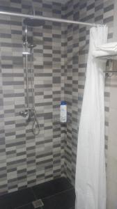 a bathroom with a shower with a shower curtain at Casa Castrelo in Retorta