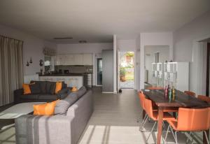 a living room with a couch and a table at Villa Dimos in Gythio