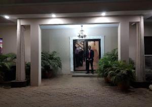 a group of men standing in the doorway of a building at Citilodge Hotel & Conference Centre Newly Renovated in Abuja