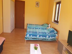 Rúm í herbergi á Apartment Stanko