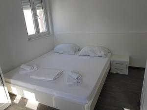 Postel nebo postele na pokoji v ubytování Apartments Vinko