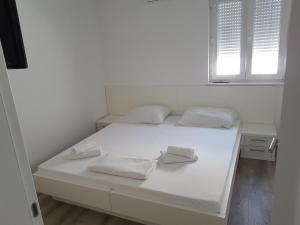 Postel nebo postele na pokoji v ubytování Apartments Vinko