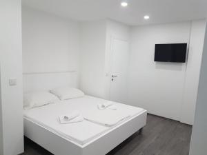 Postel nebo postele na pokoji v ubytování Apartments Vinko