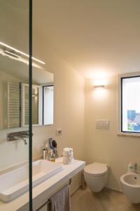 a bathroom with a sink and a toilet at Casina Tuareg in Livorno