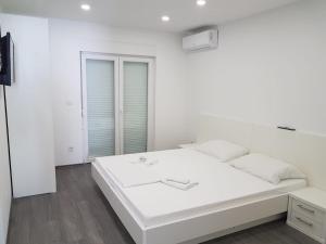 Postel nebo postele na pokoji v ubytování Apartments Vinko