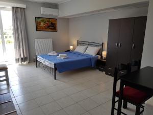 Postel nebo postele na pokoji v ubytování Hotel Apollon
