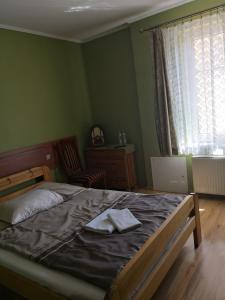 En eller flere senge i et værelse på POD ORŁEM