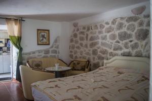 Postel nebo postele na pokoji v ubytování Apartments Subotic