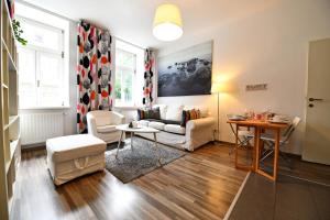 A seating area at GOOD(wo)MAN'S HOME I
