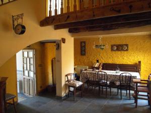 a dining room with a table and chairs at El Peralón de León in  La Aldea de la Valdoncina