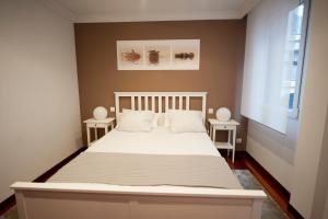 A bed or beds in a room at Calle Río de la Pila