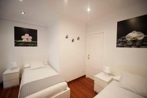 A bed or beds in a room at Calle Río de la Pila