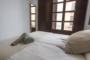 Postel nebo postele na pokoji v ubytování Apartamentos Málaga Picasso